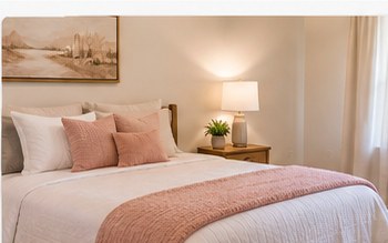 Representative comfortable bedroom with warm neutral furnishings